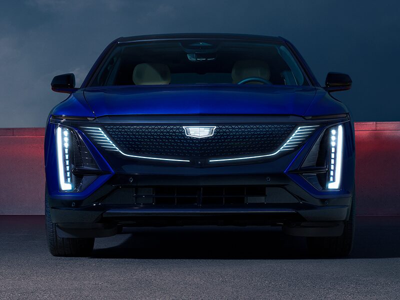 Front View of a Parked Blue 2025 Cadillac LYRIQ and Close-up on LED Slim Headlights
