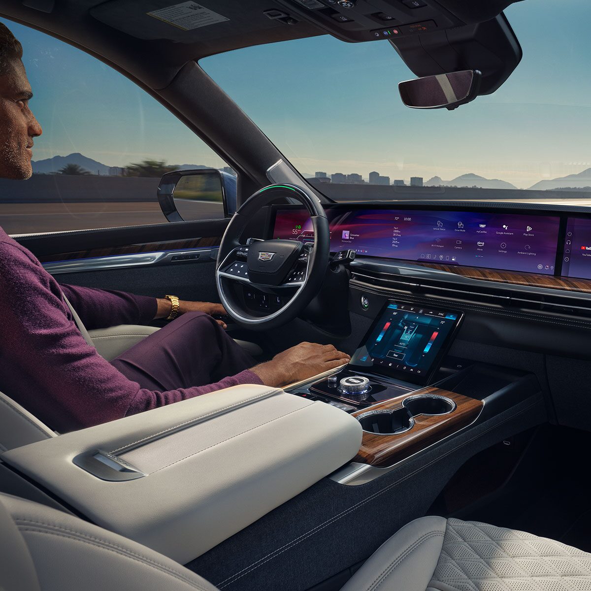 Driver's View of the 2025 OPTIQ Front Interior Cabin with Reddish Brown Leather Seating