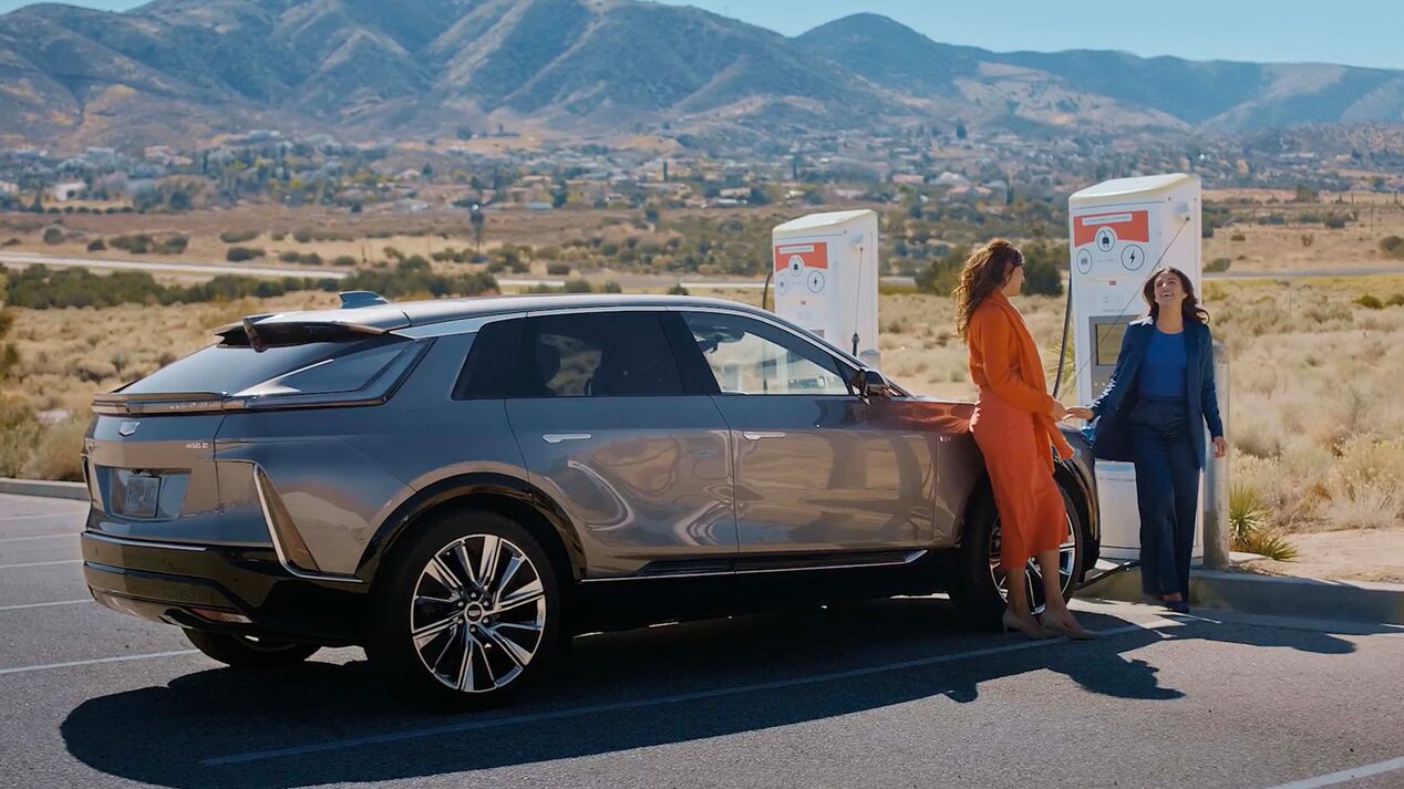 Two Women Chat As Their Cadillac LYRIQ Fast Charges