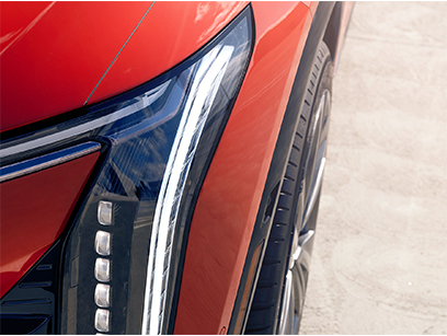 Close up of the OPTIQ headlights and wheel.