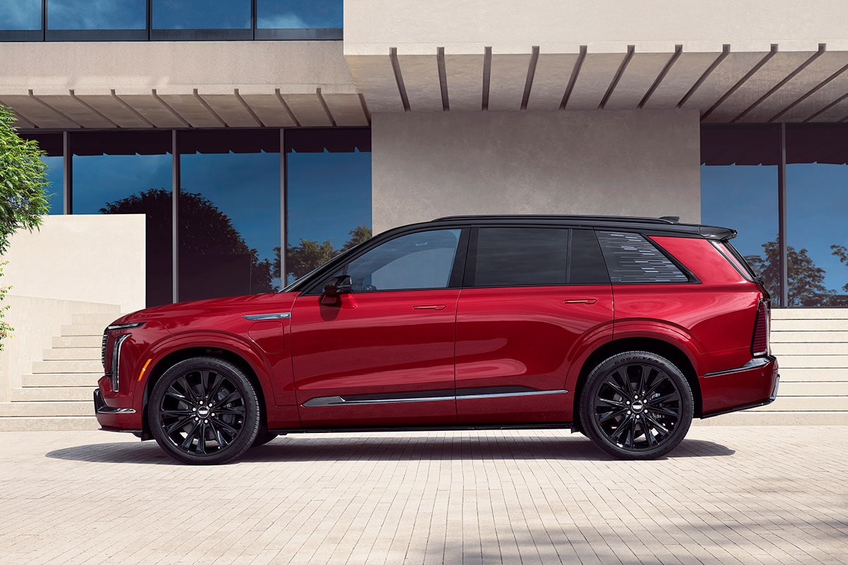 Three-quarters View of the 2026 Cadillac VISTIQ Parked Near a Lake Surrounded by Mountains