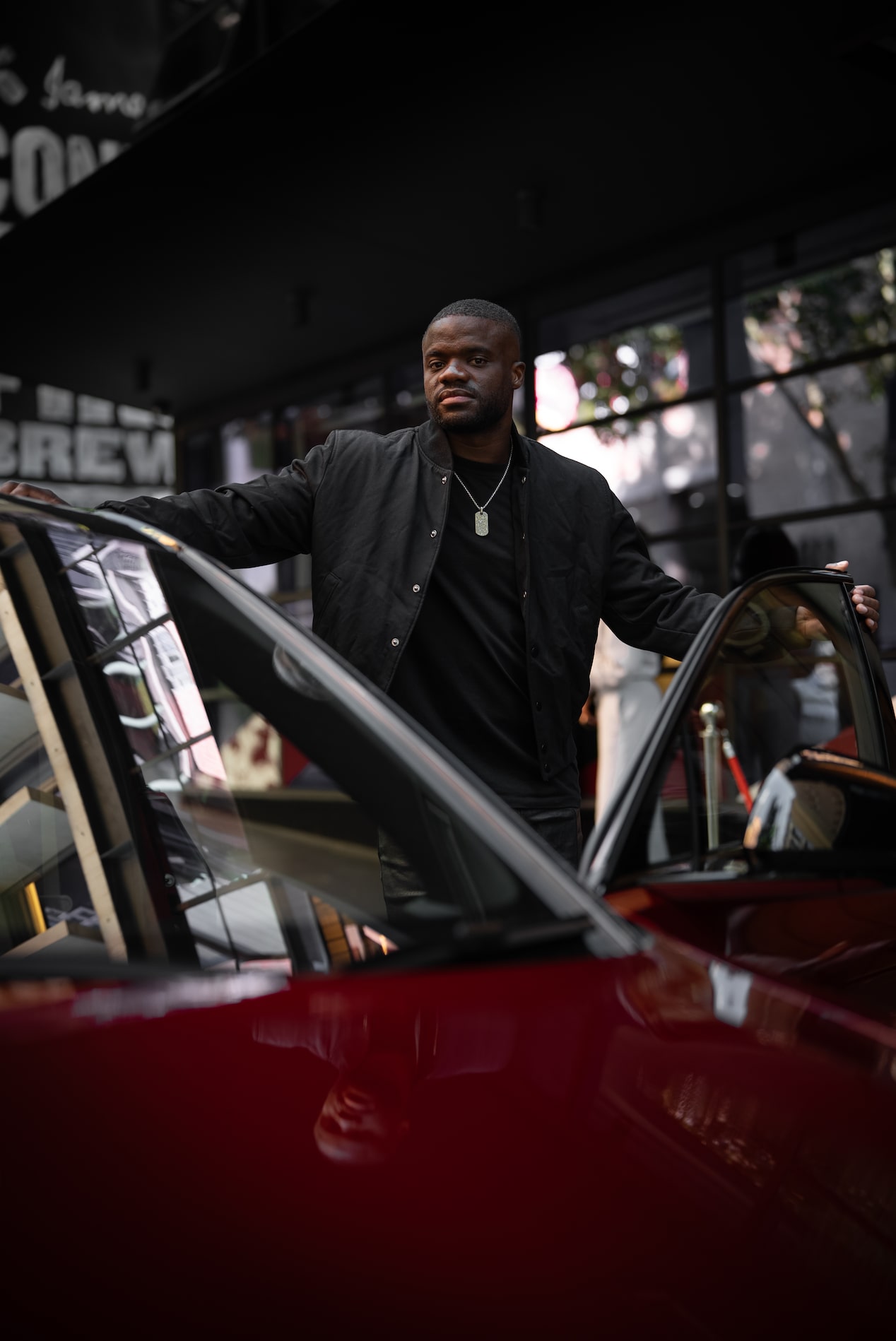 Frances Tiafoe standing with Cadillac Lyriq