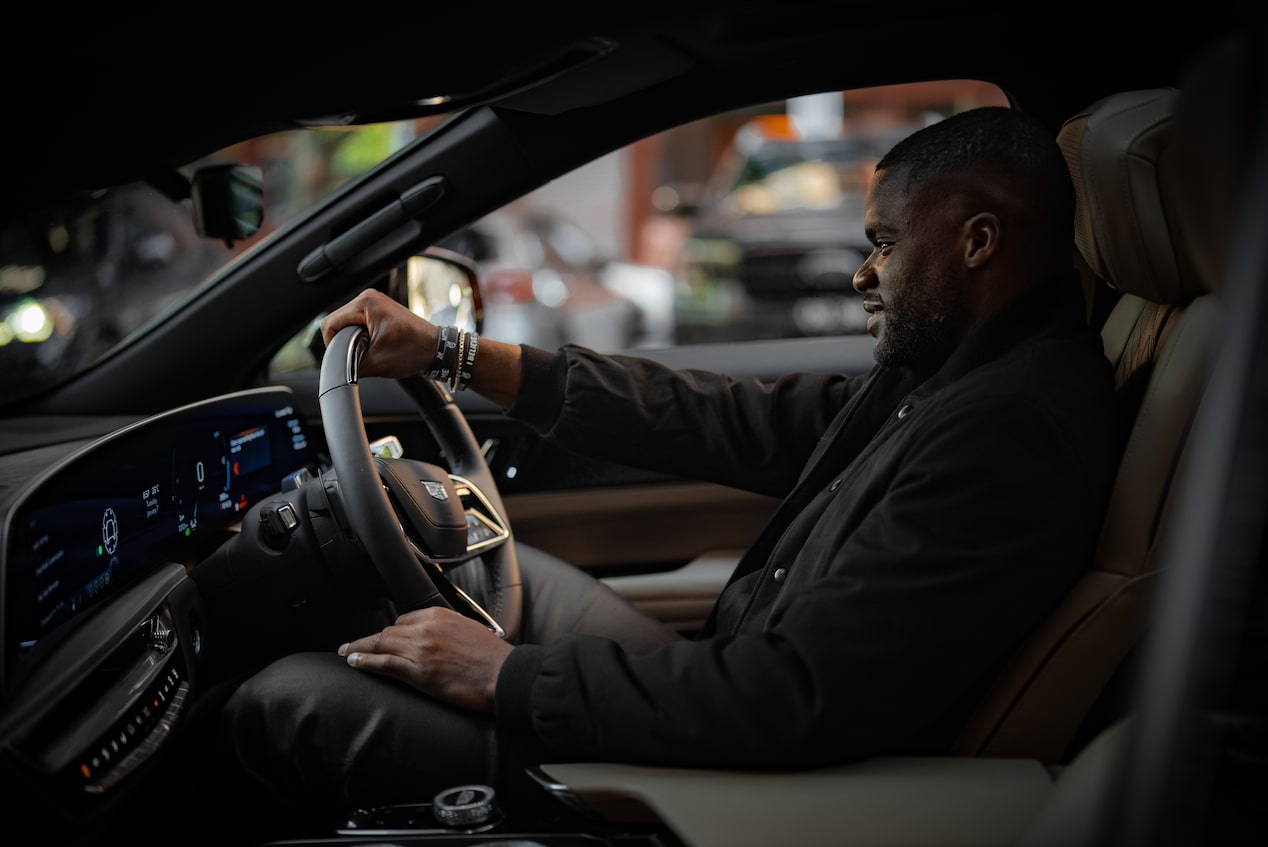 Frances Tiafoe driving Cadillac